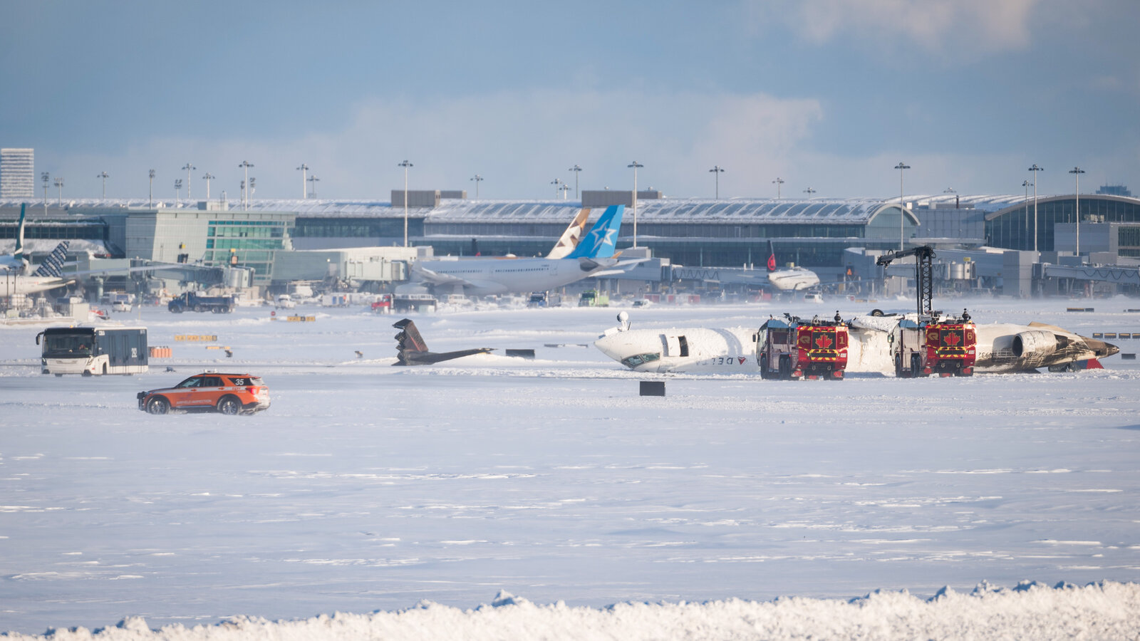 delta jet crashes at toronto pearson airport in canada emergency crews responding as plane flips upside down 1